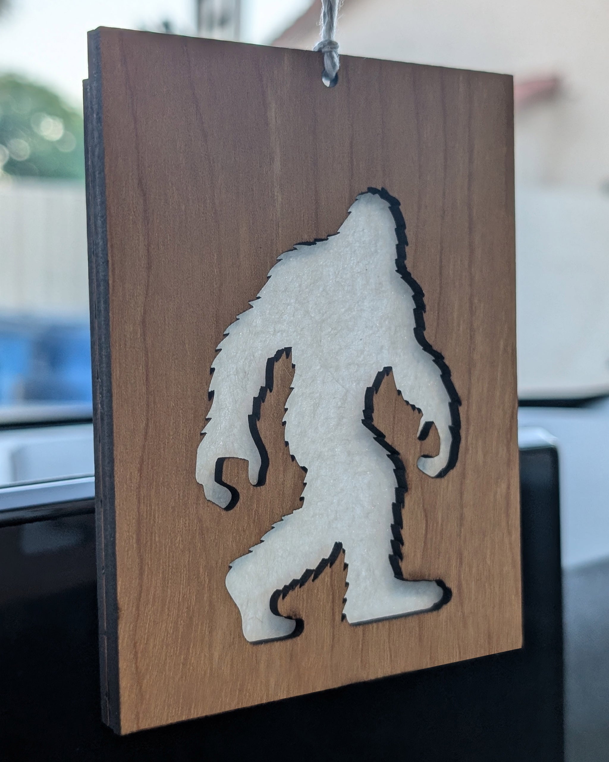 Wooden air freshener made from Baltic birch featuring a Bigfoot silhouette with a felt insert for scent.
