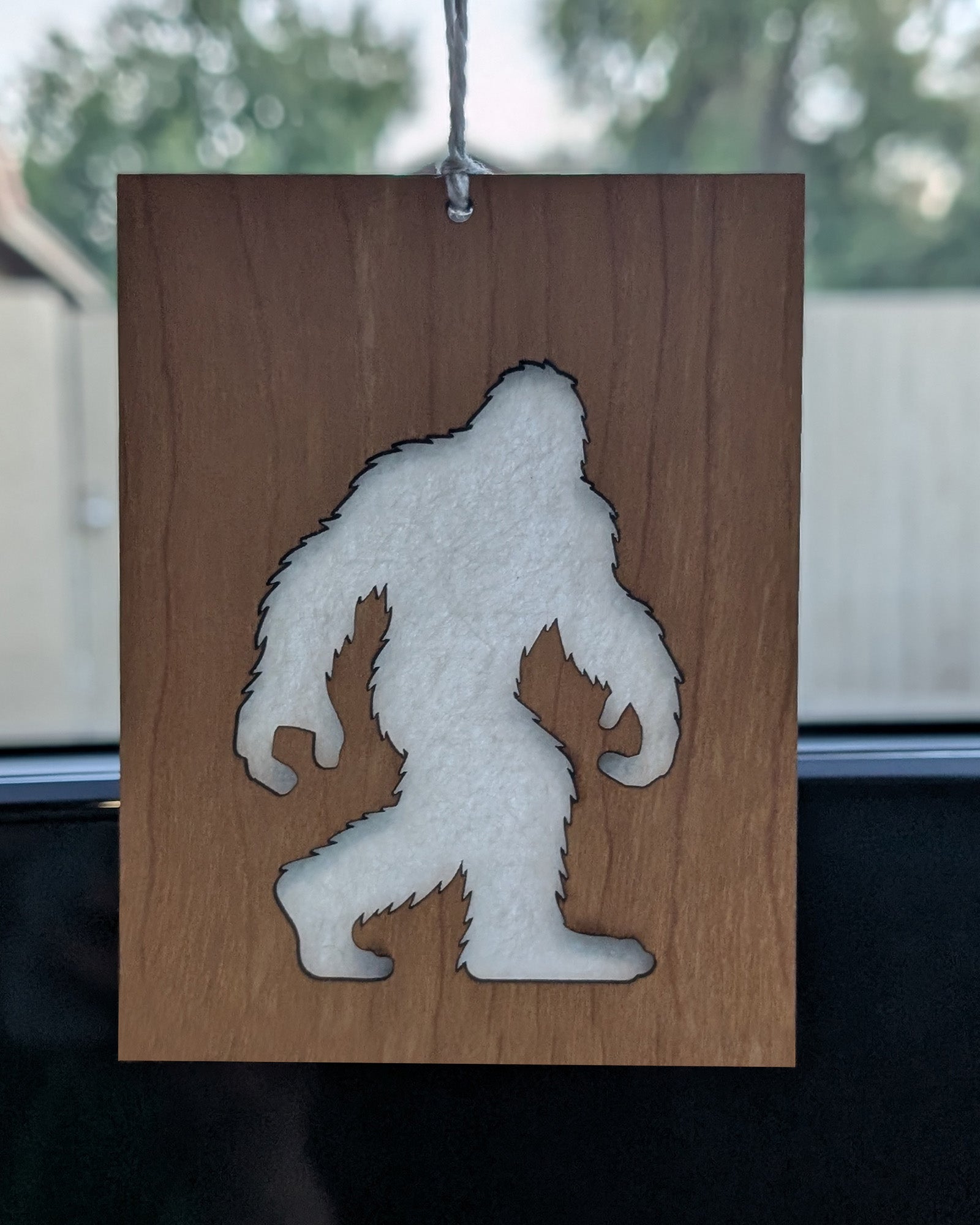 Wooden air freshener made from Baltic birch featuring a Bigfoot silhouette with a felt insert for scent.