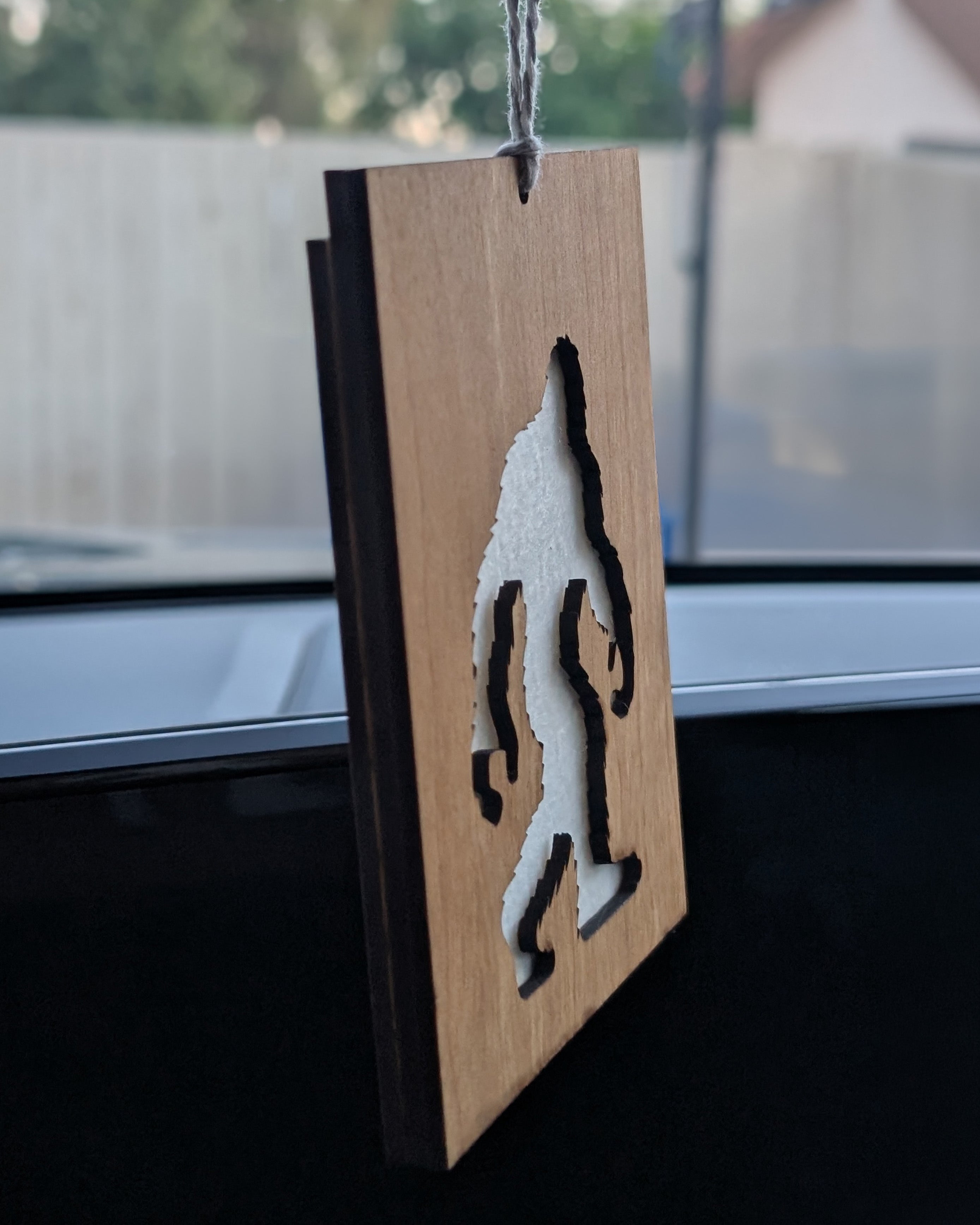 Wooden air freshener made from Baltic birch featuring a Bigfoot silhouette with a felt insert for scent.